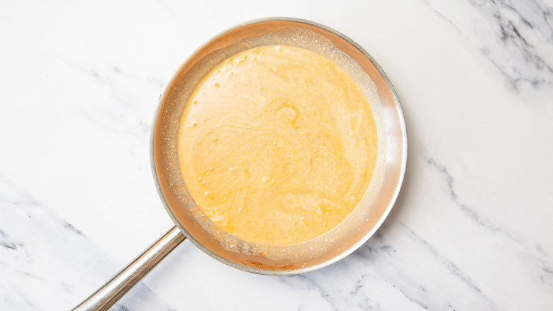 Red curry sauce in pan.