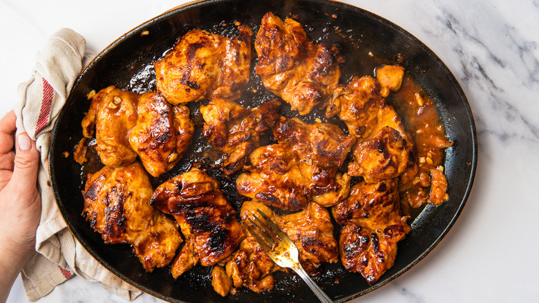 Cooking Korean chicken in cast iron skillet.