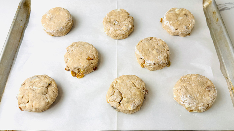 Unbaked biscuits on baking sheet