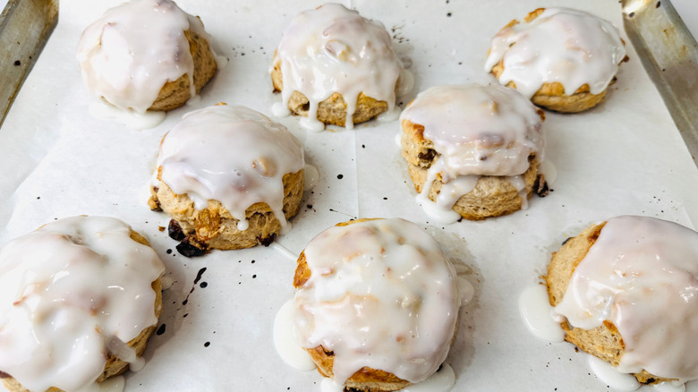 Glazed biscuits on baking sheet