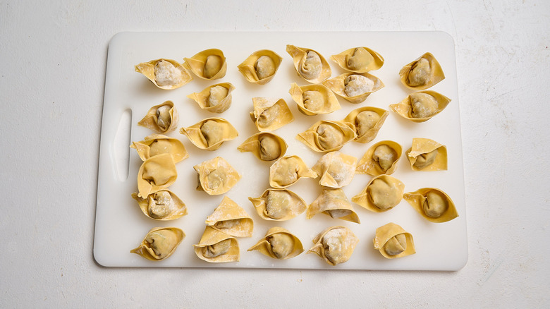 folded dumplings on table