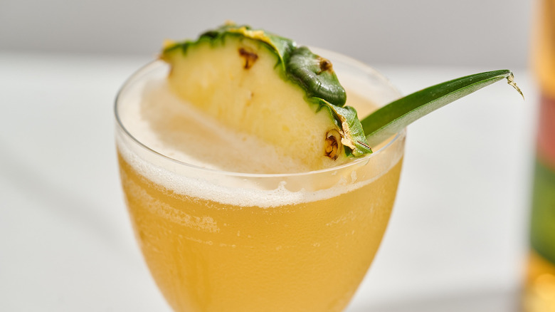 close up of pineapple garnish on cocktail
