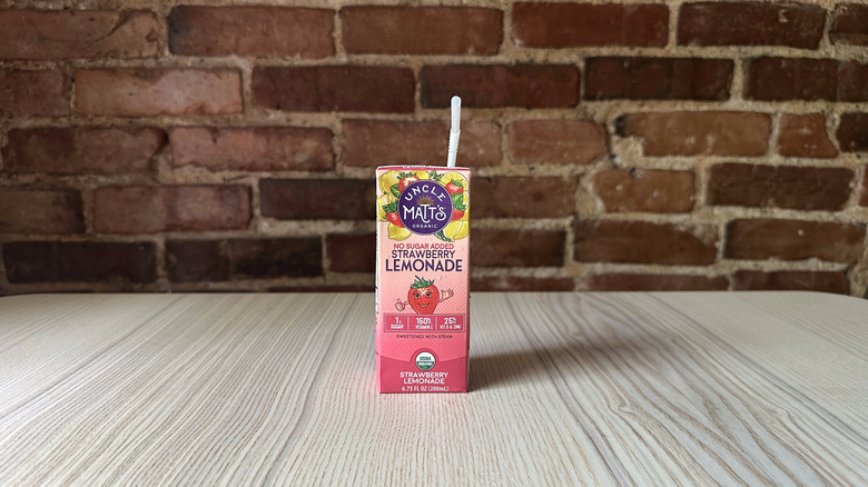 Uncle Matt's No Sugar Added Strawberry Lemonade with brick background