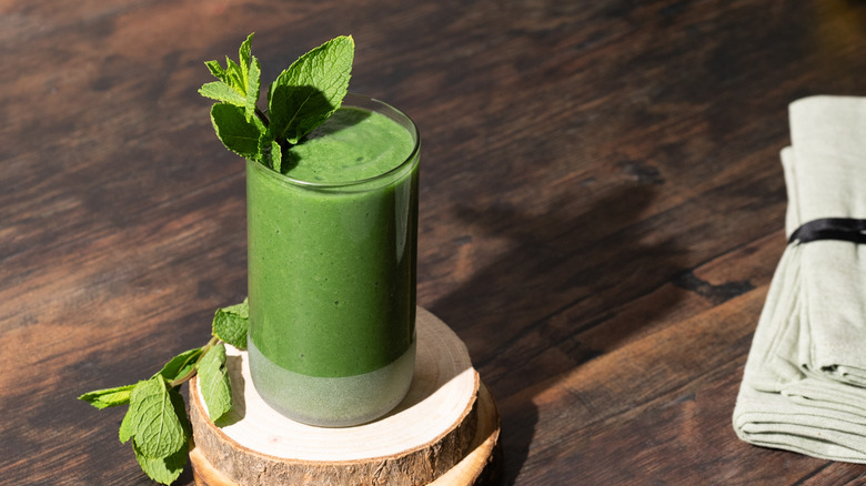 Green smoothie garnished with mint