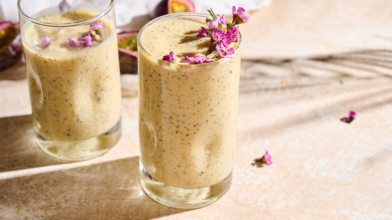 Passion fruit smoothie garnished with flowers