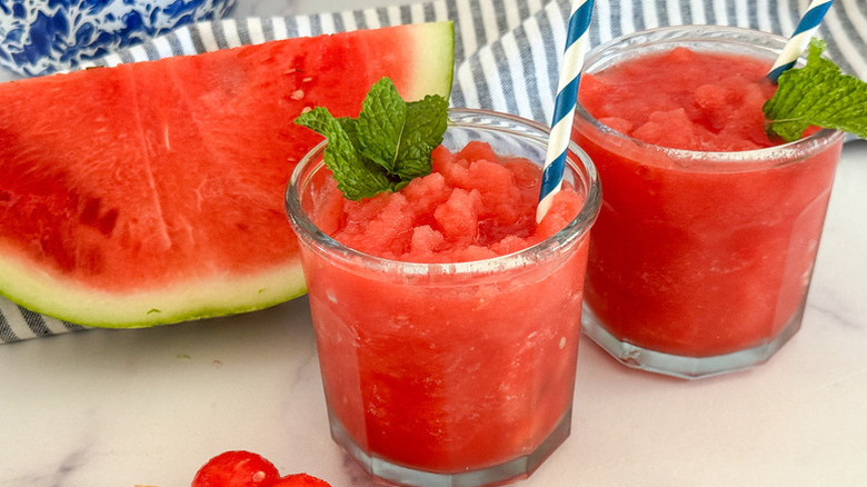 Watermelon slushies in glasses with mint garnishes