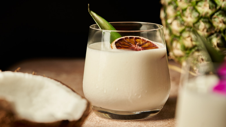Pina colada garnished with dried orange slice