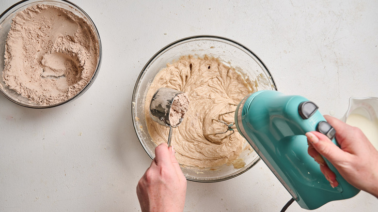 beating buttermilk and flour into batter