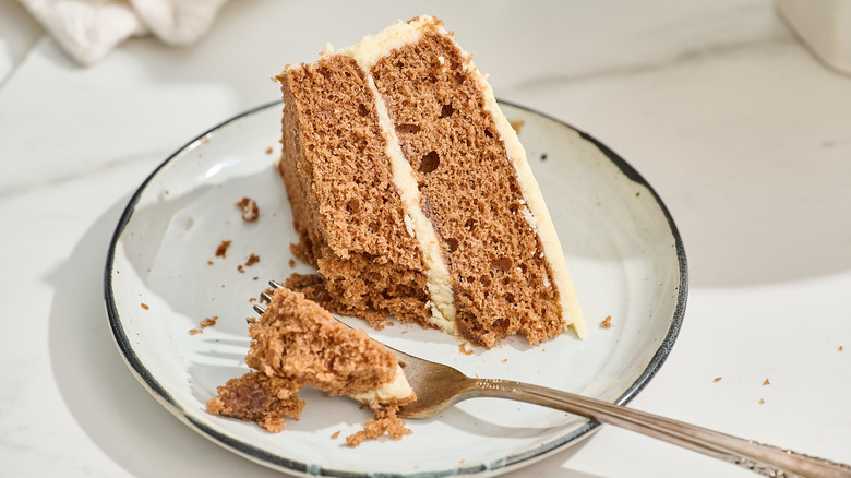 slice of cake on a plate with a fork
