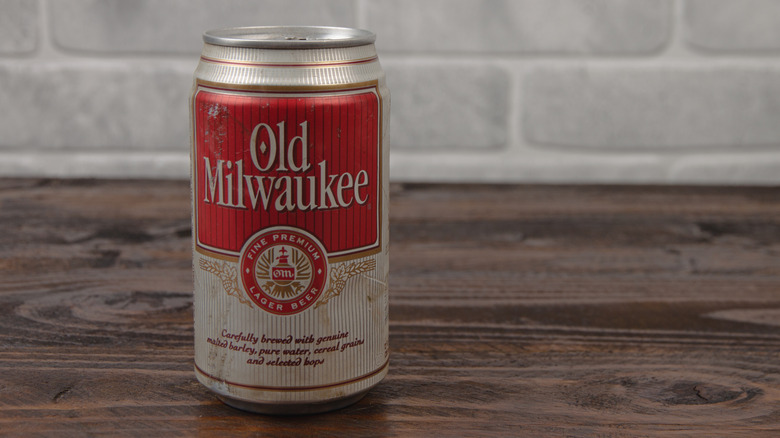 vintage can of Old Milwaukee beer against brick wall