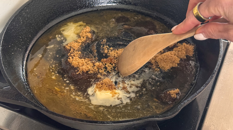wooden spoon in pan stirring glaze