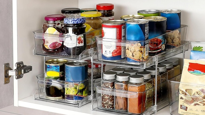 Pantry organizer with jars of condiments and spices