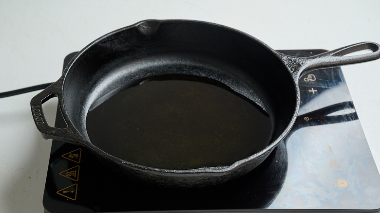 heating oil in a skillet