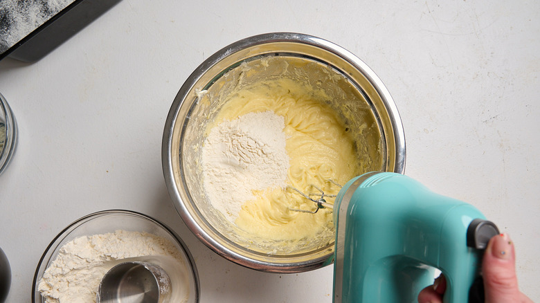 flour being added to batter