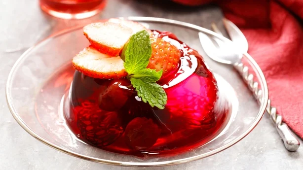 berry fruit jelly with fresh fruits - summer dessert