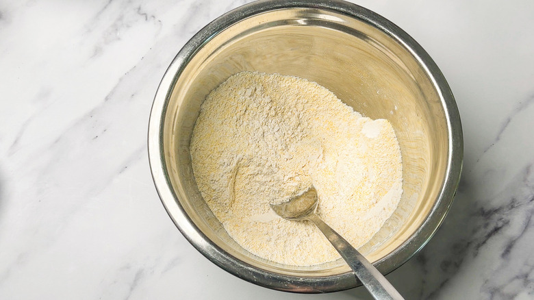 Whisking dry ingredients.