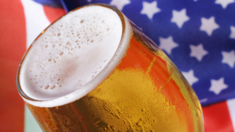 Pint of beer with blurred American flag background