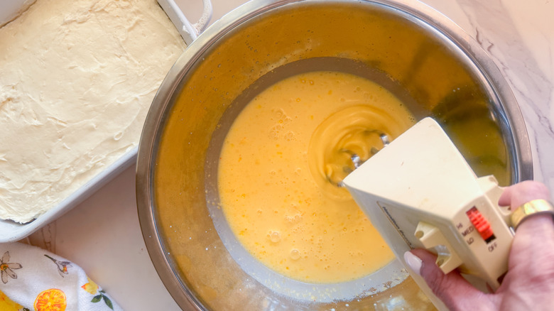 hand beating pudding mixture