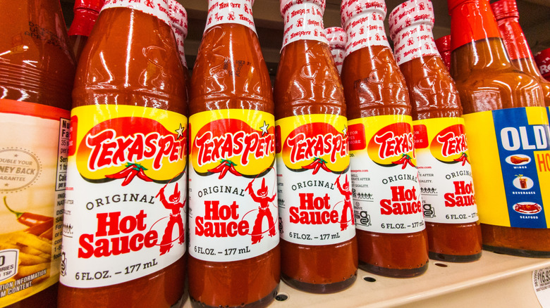 Bottles Of Texas Pete Hot Sauce Products Displayed On Grocery Store Shelf