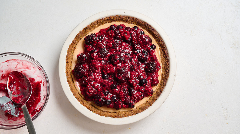 key lime pie topped with berry compote