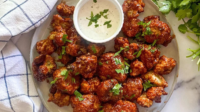 Easy Air Fryer BBQ Cauliflower Wings on plate with dipping sauce