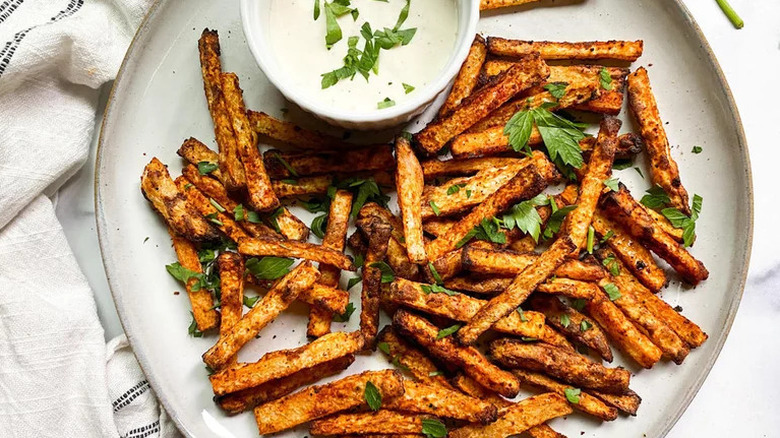 Air Fryer Jicama Fries on white plate with dipping sauce