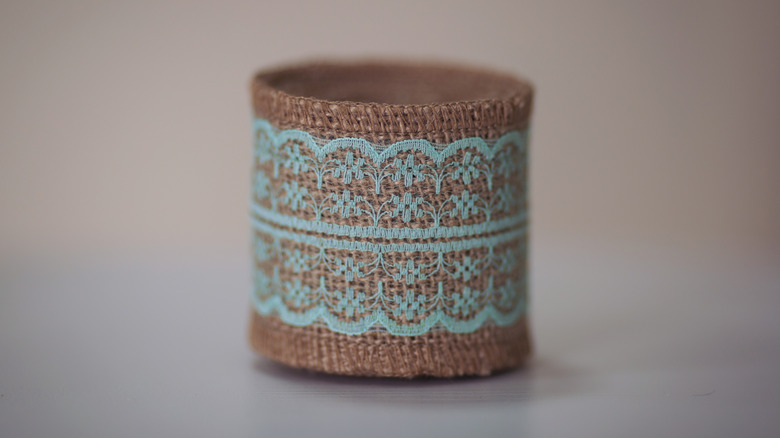 homemade decorated container with burlap and lace