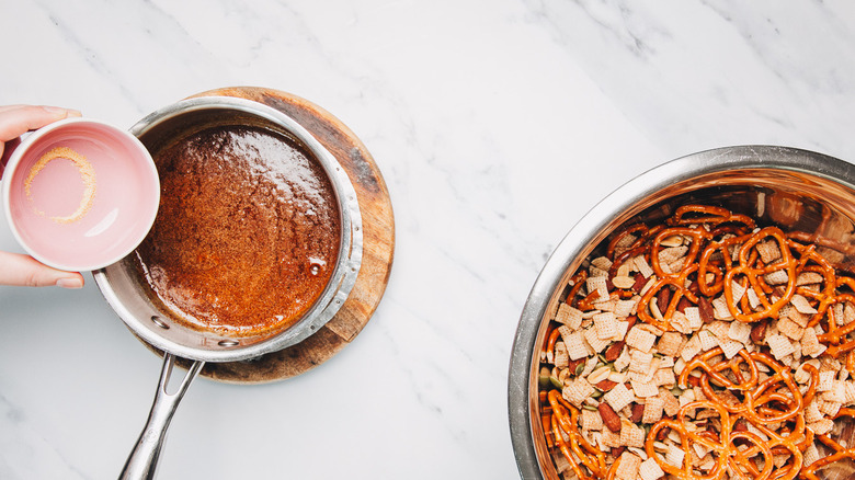 Adding fish sauce to browned butter.