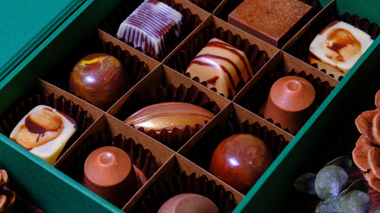 Box of fancy chocolates in a teal box