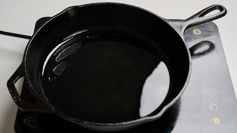 heating oil in a skillet
