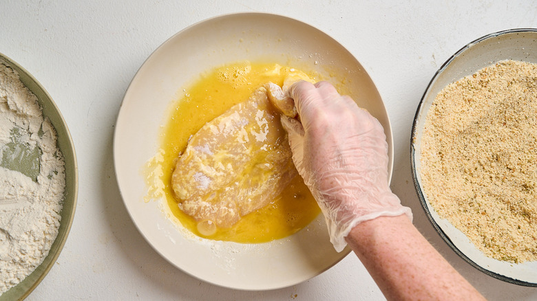 submerging chicken in egg