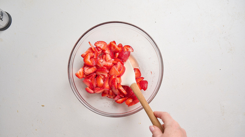 strawberries mixed with sugar and balsamic in a bowl