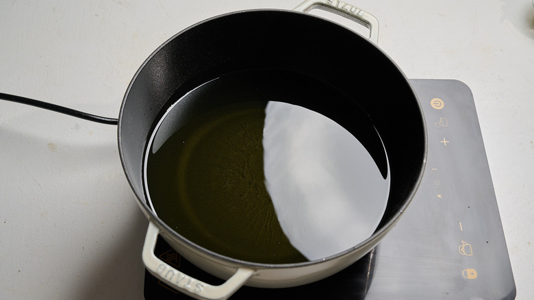 heating oil in a pot