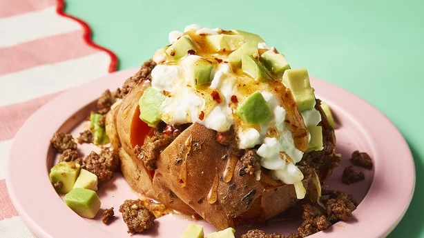 A baked potato topped with chilli