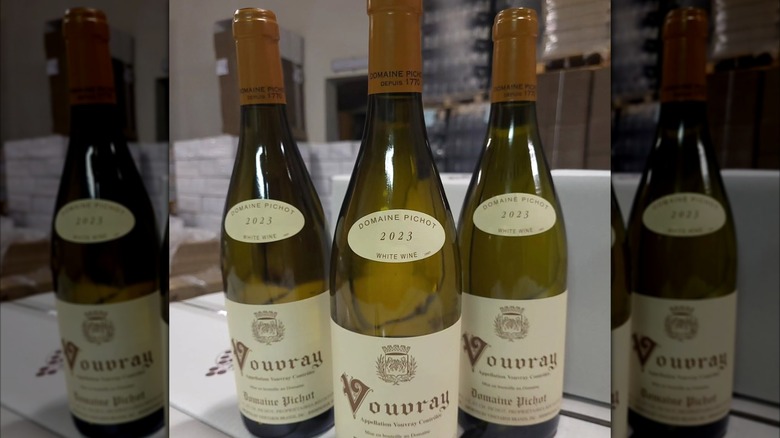 three bottles of white wine