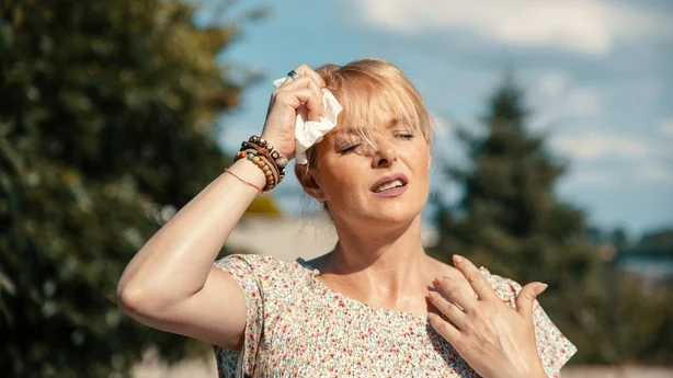 Woman feeling bad pain, heat, woman with heatstroke. 