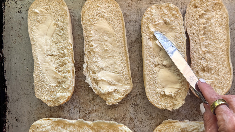 hand buttering bread
