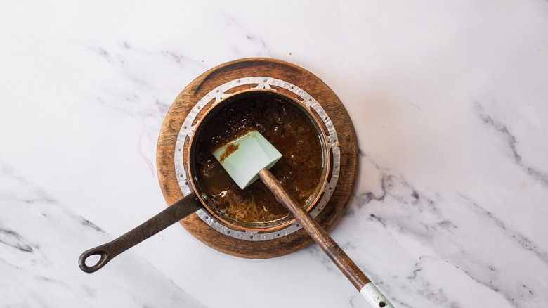 Brown sugar and butter in saucepan
