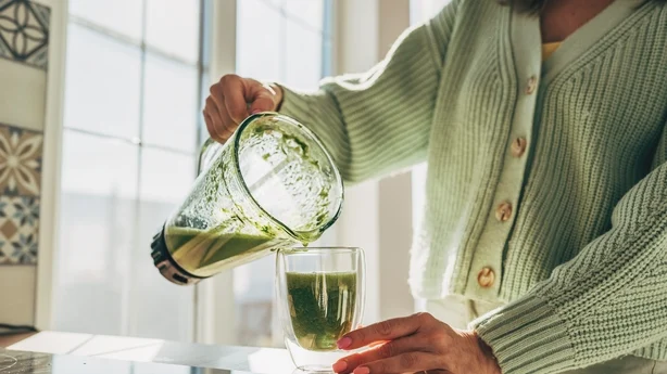 Young Woman Making Detox Smoothie 