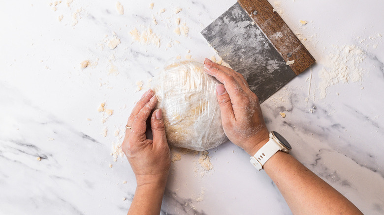 Rolling the dough into a disc