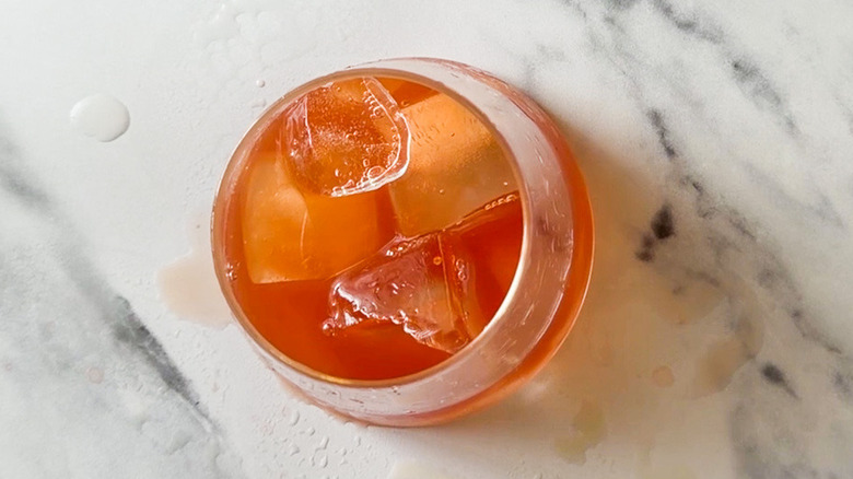 Orange rum sunset cocktail in glass