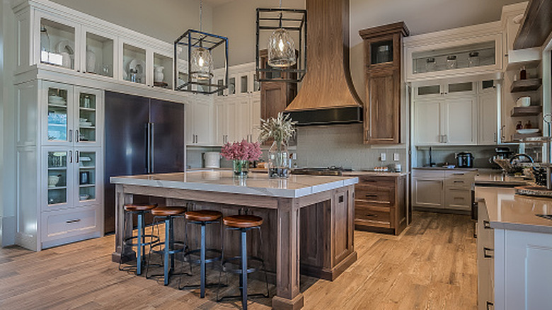 A stylish kitchen filled with bold statement elements, but with poor lighting for the workspaces