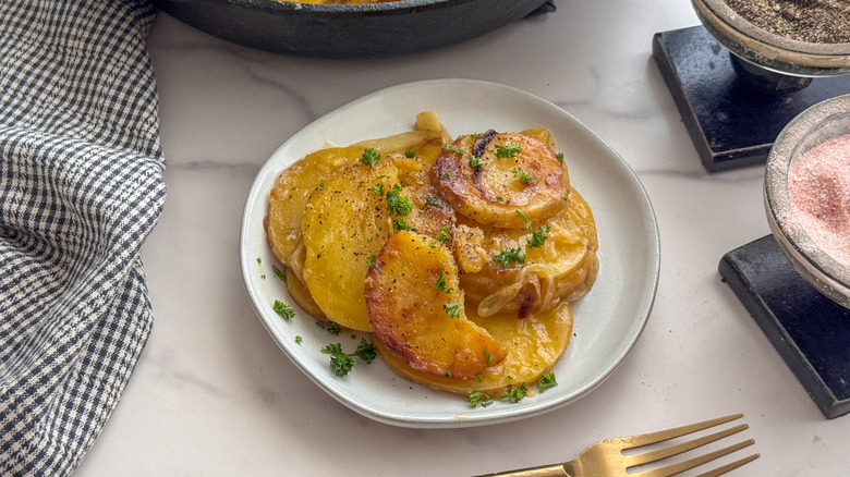 smothered potato serving on plate