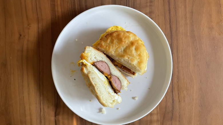 Smoked sausage breakfast sandwich on a plate
