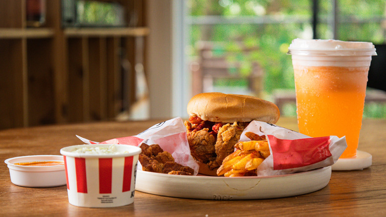 Side view of the Flamin' Hot Chicken Sandwich Box Meal on a table