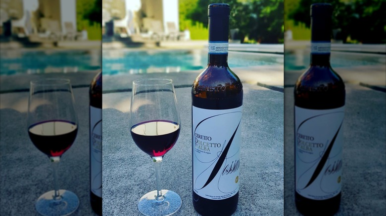 bottle and glass of red wine