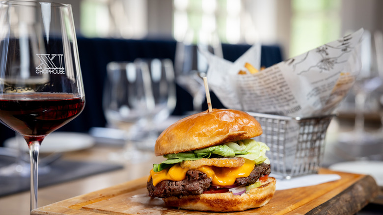 cheeseburger with red wine glass