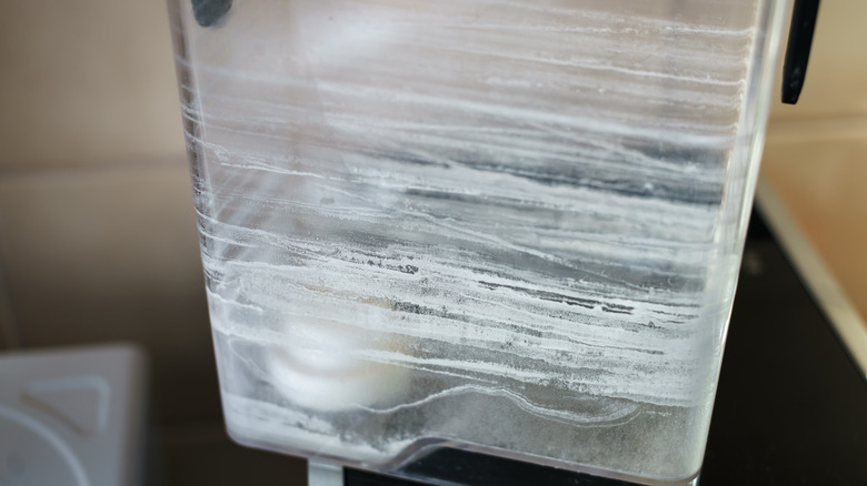 Limescale in a water container for a coffee machine