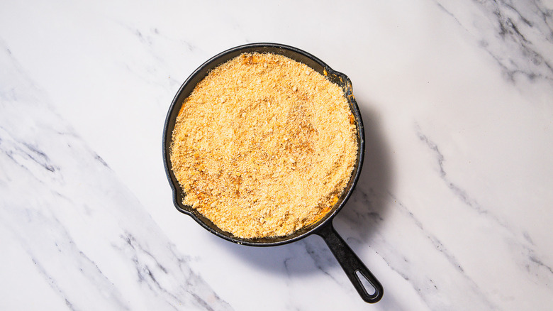 Unbaked Nashville hot chicken dip with cracker topping