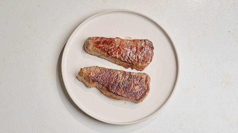 steaks resting on a plate